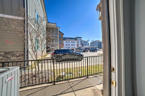 a balcony with a car parked on a street at Modern Retreat about half Mi to Bryant-Denny Stadium in Tuscaloosa