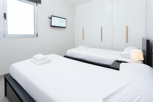 Ein Bett oder Betten in einem Zimmer der Unterkunft Catalina Downtown By CanariasGetaway