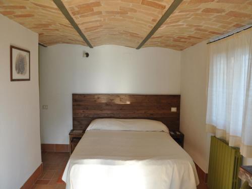 A bed or beds in a room at Casa Dona' Penne