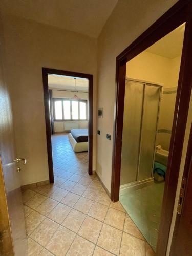a room with a door leading to a bedroom at Pernice 77 in Sulzano
