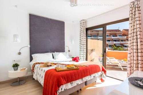 Postel nebo postele na pokoji v ubytování Tenerife Royal Gardens - Viviendas Vacacionales
