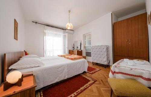 Postel nebo postele na pokoji v ubytování Rooms Dragica