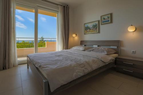 Ένα ή περισσότερα κρεβάτια σε δωμάτιο στο DOMINO