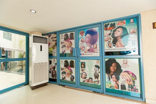 a room with a bunch of pictures on the wall at Best Western Premier Accra Airport Hotel in Accra