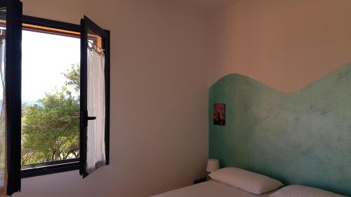 Postel nebo postele na pokoji v ubytování New Camping Coccorrocci