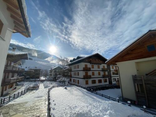a view from the balcony of a building in the snow at Chalet dei Reparti Bormio in Bormio
