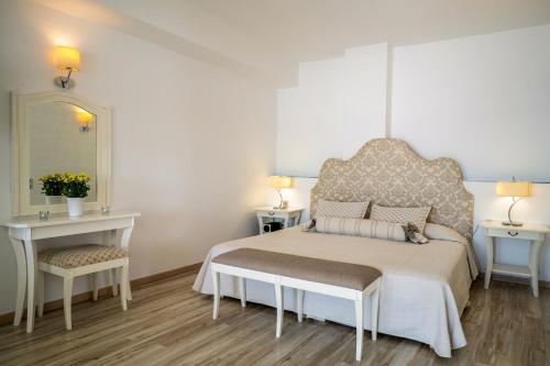 Postel nebo postele na pokoji v ubytování Delfini Villas