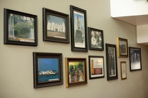 a group of pictures on a wall at Best Western Premier Accra Airport Hotel in Accra