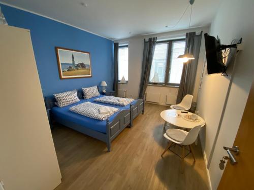 En eller flere senge i et værelse på Gästehaus Lavendel