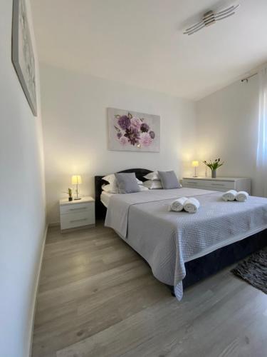 Ένα ή περισσότερα κρεβάτια σε δωμάτιο στο Apartman Antonio