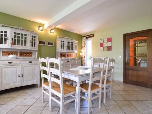 a dining room with a table and chairs at Holiday Home in Ardennes with Sauna in Jehonville