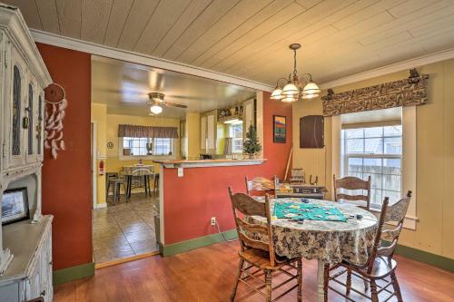 a dining room and kitchen with a table and chairs at Downtown Cabin Less Than 10 Miles to Mt Shasta Ski Park! in McCloud