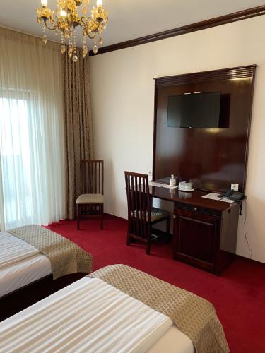 Postel nebo postele na pokoji v ubytování Hotel Onix