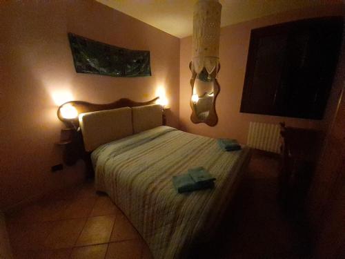 Ein Bett oder Betten in einem Zimmer der Unterkunft Rifugio escursionistico La Sousto dal Col