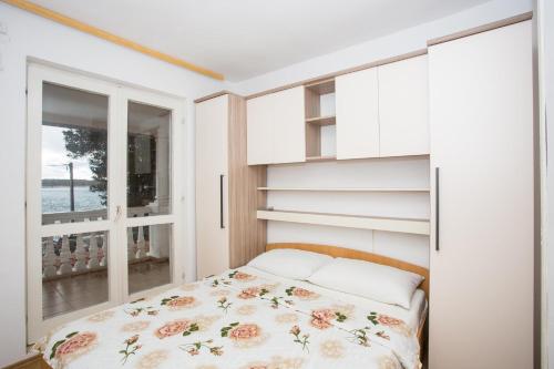 Ένα ή περισσότερα κρεβάτια σε δωμάτιο στο Rooms Katica B&B