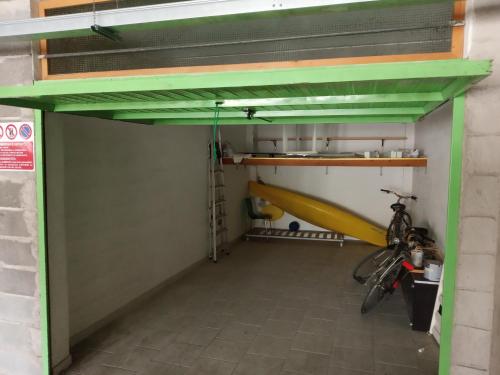 an empty garage with a bike parked in it at Fronte mare in Marotta