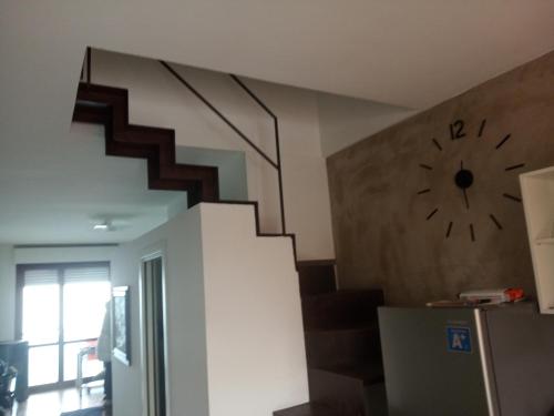 a clock on the wall next to a staircase with a clock at Fronte mare in Marotta