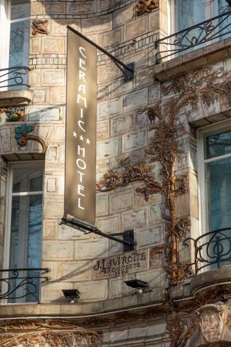 a sign on the side of a building at Elysées Ceramic in Paris