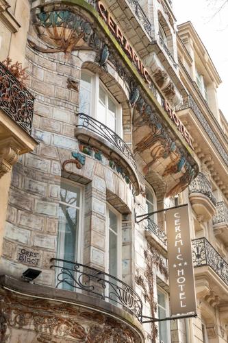 a building with a sign on the side of it at Elysées Ceramic in Paris