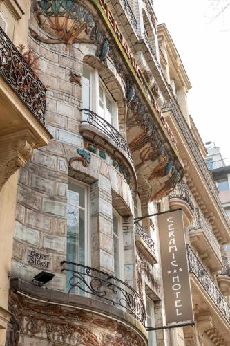 a building with a sign on the side of it at Elysées Ceramic in Paris