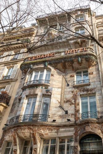 a building with a sign on the side of it at Elysées Ceramic in Paris