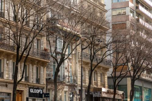 a group of trees in front of a building at Elysées Ceramic in Paris