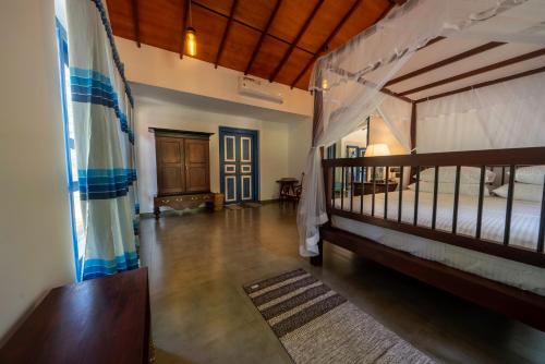 a room with two bunk beds and a hallway at 5BR Luxury Villa with Pool the Blues in Mihiripenne