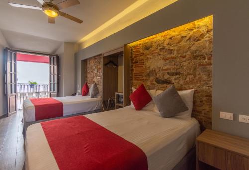 Postel nebo postele na pokoji v ubytování Hotel Hidalgo