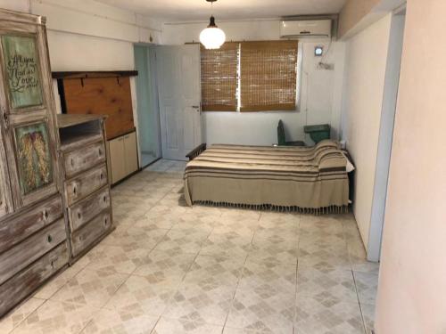 Ένα ή περισσότερα κρεβάτια σε δωμάτιο στο Casa Miradores del Lago