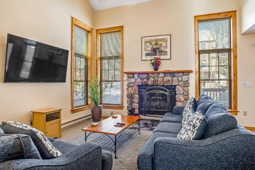 a living room with two couches and a fireplace at Northridge 181 in Tannersville
