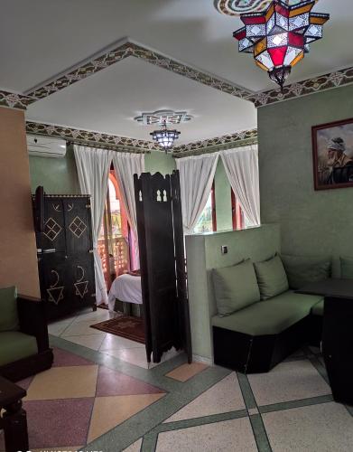 a living room with a couch and a window at Equi Palace & SPA Near Aeroport in Berrechid