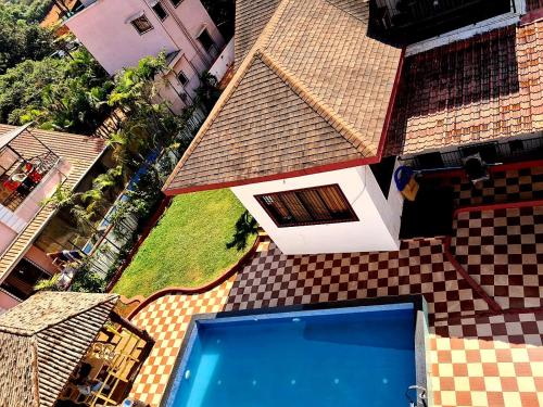 an overhead view of a house with a swimming pool at Nilgiri Villa with Swimming Pool in Mahabaleshwar