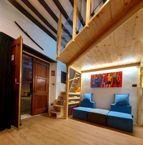 a living room with a couch and a bunk bed at Guest House Piazza Marconi in Amelia