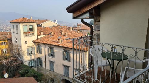 a balcony with a view of some buildings at Hotel Piazza Vecchia in Bergamo