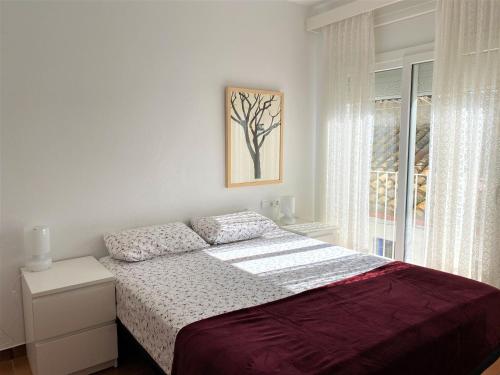 Posteľ alebo postele v izbe v ubytovaní TÒRTORA - Casa en el centro con vistas al mar