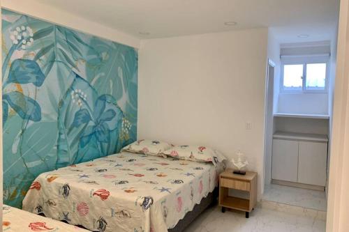 Apartamentos CC San Andres cerca a la playaにあるベッド