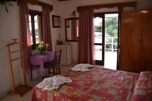 Postel nebo postele na pokoji v ubytování Hotel Palmas del Sol