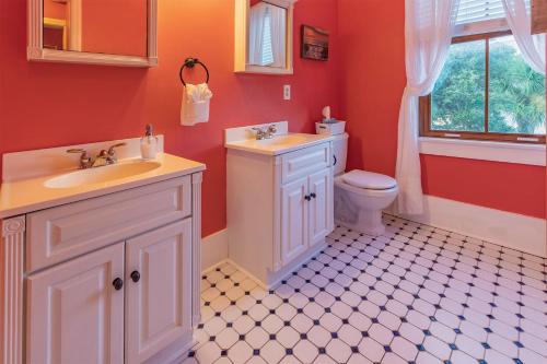 a bathroom with a sink and a toilet at Surf Song Bed & Breakfast in Tybee Island