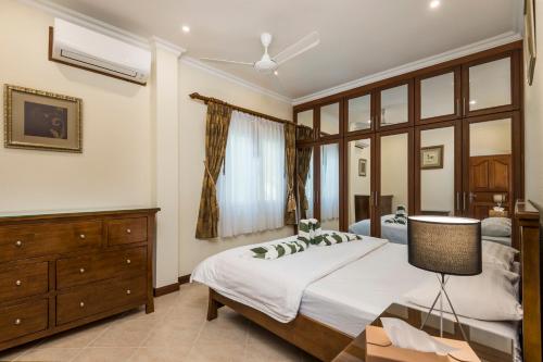 Katil atau katil-katil dalam bilik di Village Austria Luxury Pool Villas