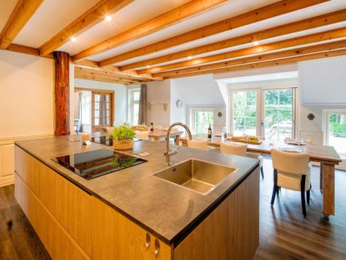 a kitchen with a sink and a counter top at Gorgeous Farmhouse with Sauna in Noardburgum in Noordbergum