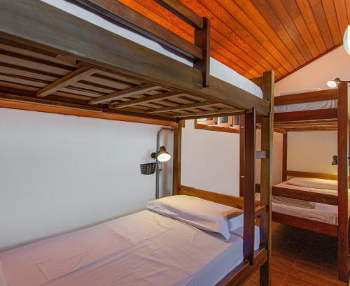 a couple of bunk beds in a room at MADÁ hostel in Sao Paulo