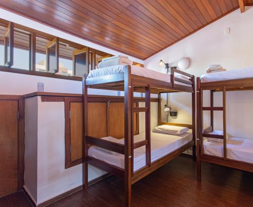a group of bunk beds in a room at MADÁ hostel in Sao Paulo