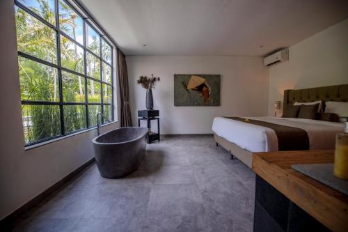 Ένα ή περισσότερα κρεβάτια σε δωμάτιο στο Lempuyang Boutique Hotel