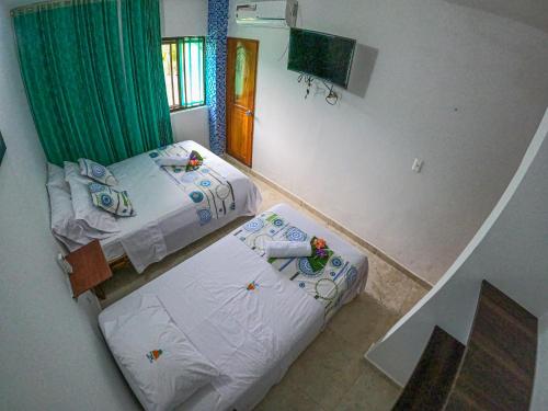 Cama o camas de una habitación en Hotel Arena Azul