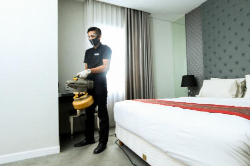 Katil atau katil-katil dalam bilik di Serela Cihampelas by KAGUM Hotels