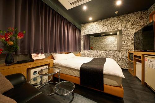 Postel nebo postele na pokoji v ubytování HOTEL Kslit Adult Only
