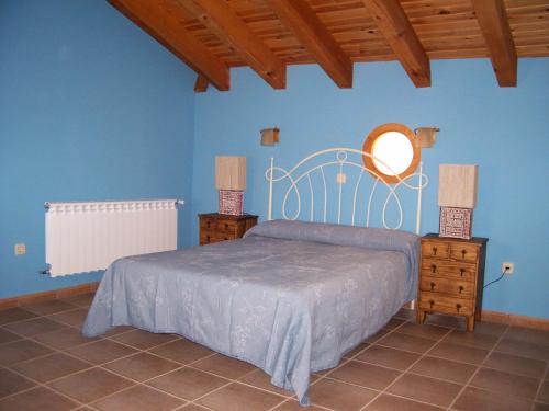 Un pat sau paturi într-o cameră la Los Camarotes