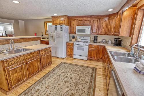a kitchen with wooden cabinets and white appliances at 33 West Washington Street in Ellicottville