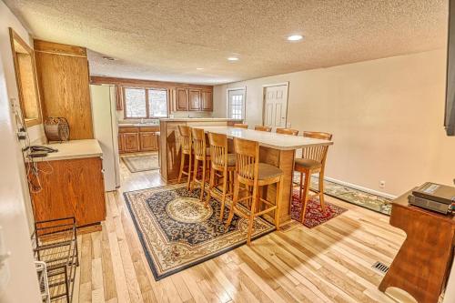 a kitchen with a table and chairs in a room at 33 West Washington Street in Ellicottville