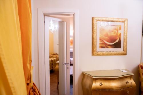 a room with a picture of a flower on the wall at Hotel Nuovo Savi in Montecatini Terme